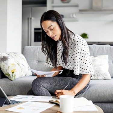 woman working on her finances at home