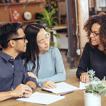 IMAGE: Couple getting advice from a real estate agent