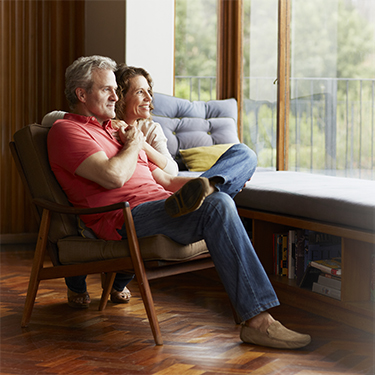 IMAGE: Couple sitting together and staring out window