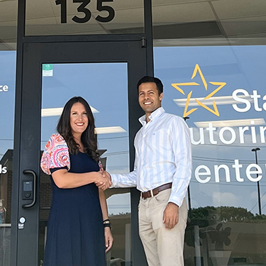 IMAGE: Star Tutoring owner Kabir and Texell's Business Officer Jessica in front of Star Tutoring Centers