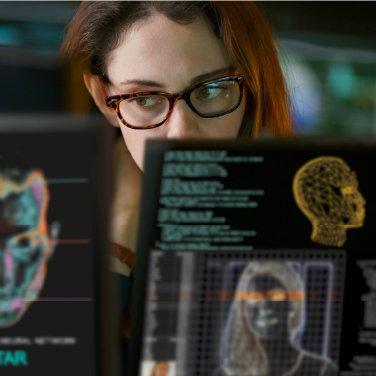 IMAGE: Woman looking suspiciously at AI tech on screens