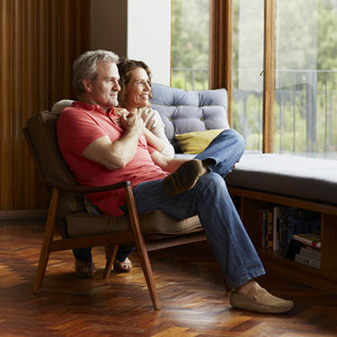 IMAGE: Couple sitting together staring out window