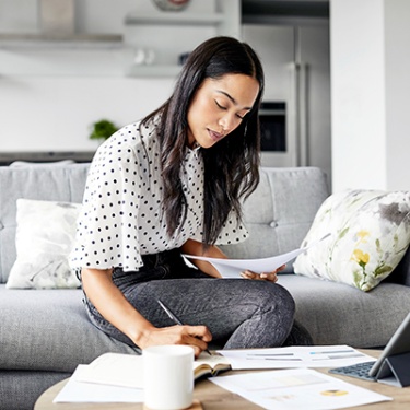 woman working on her finances at home