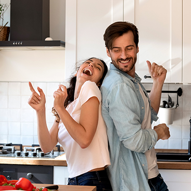 IMAGE: Couple dancing in kitchen