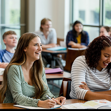 IMAGE: Group of high school students sitting inside classroom