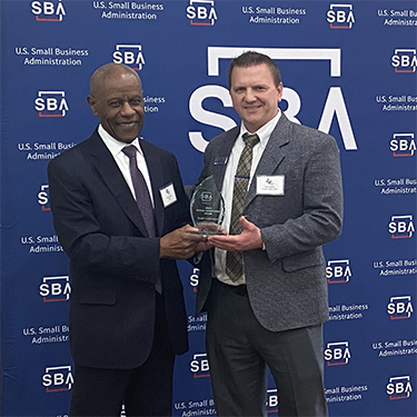 IMAGE: VP of Commercial Services Galen Burke receiving SBA #1 in Credit Union Lending Award