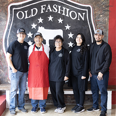 IMAGE: Owners of Old Fashion Meat Market inside store