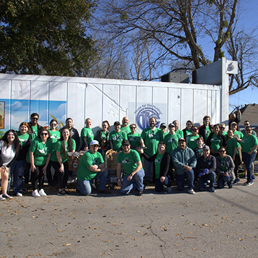 IMAGE: Texell team members gathered at Churches Touching Lives for Christ in Temple to help families in need, part of a Texell Serves event.