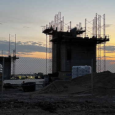 IMAGE: Headquarters building in progress at sunset