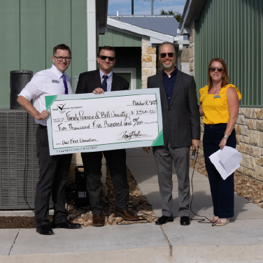 IMAGE: Tony Hale and Galen Burke from the Texell Serves Foundation present a donation to Rucker Preston and Emily Lavin from Family Promise of Bell County.