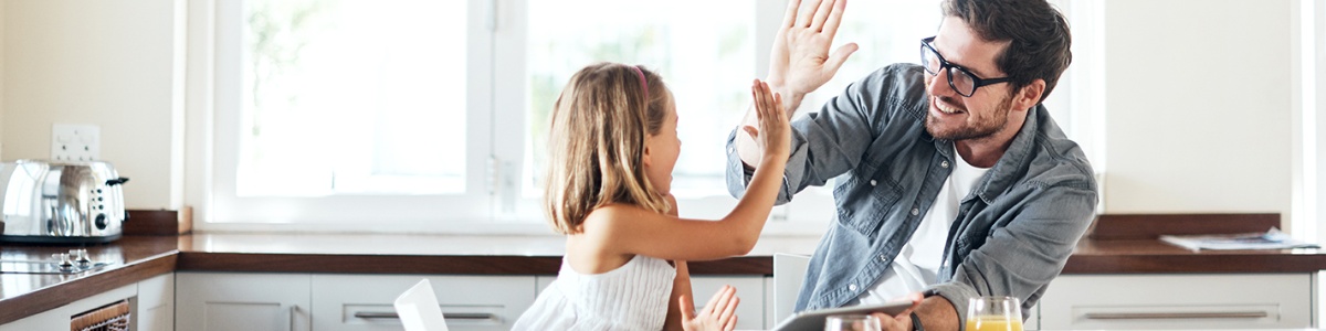 father and daughter high-fiving each other