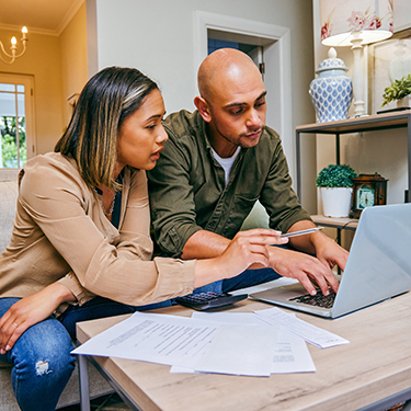 IMAGE: Couple looking at laptop together