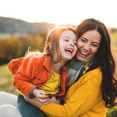 mother laughing with her little girl